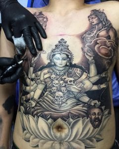Durga tattoo on the abdomen