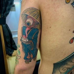Tofu Boy tattoo on the arm