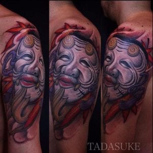 Okina mask tattoo