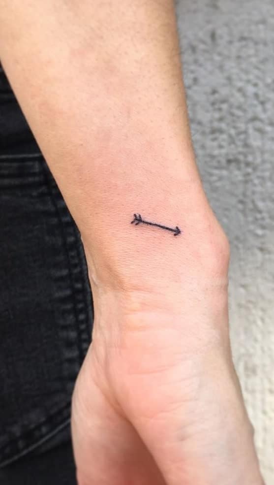 Stick and Poke Arrow Tattoo on Wrist