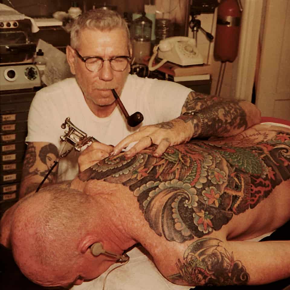 Sailor Jerry tattooing on a client
