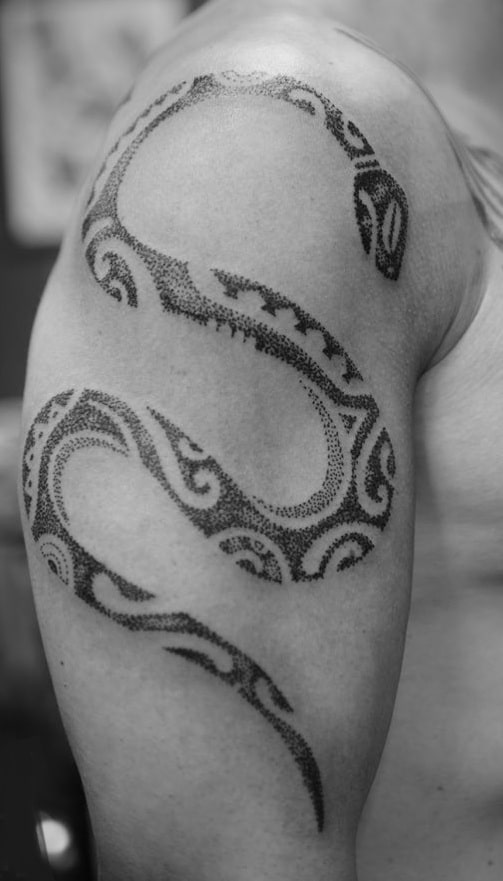 Snake Tattoos: Main Themes, Tattoo Styles & Placement